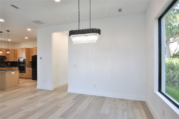 Chandelier, Interior, Kitchen, Pendant Lights, Recessed Lighting, Stainless Steel Appliances, Wood Texture Flooring
