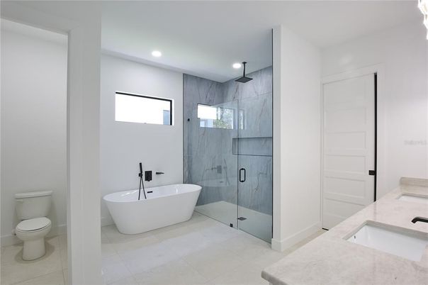 Bathroom, Free Standing Baths, Glass Shower, Interior, Marble Walls, Recessed Lighting