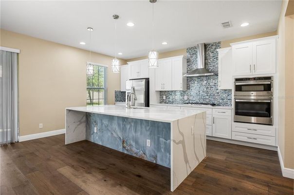 Interior, Kitchen, Pendant Lights, Recessed Lighting, Stainless Steel Appliances, Wood Texture Flooring