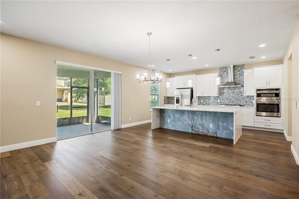 Chandelier, Interior, Kitchen, Pendant Lights, Recessed Lighting, Stainless Steel Appliances, Wood Texture Flooring