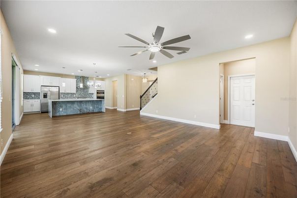Empty room, Interior, Kitchen, Pendant Lights, Recessed Lighting, Stainless Steel Appliances, Wood Texture Flooring