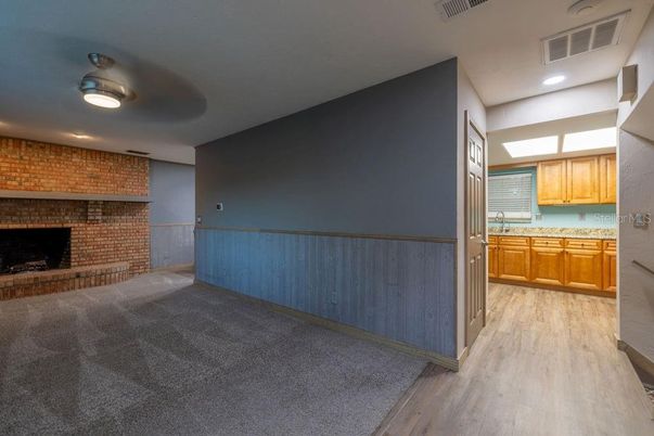 Fireplace, Interior, Kitchen, Recessed Lighting, Stone Walls, Wood Texture Flooring