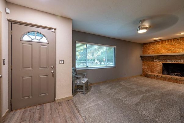 Empty room, Fireplace, Interior, Recessed Lighting, Stone Walls, Wood Texture Flooring