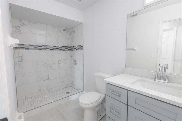 Bathroom, Glass Shower, Interior, Marble Walls, Wood Texture Flooring