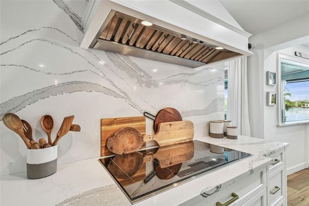 Interior, Kitchen, Marble Walls, Recessed Lighting, Stainless Steel Appliances, Wood Texture Flooring