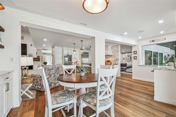 Dining room, Interior, Kitchen, Pendant Lights, Recessed Lighting, Stainless Steel Appliances, Wood Texture Flooring