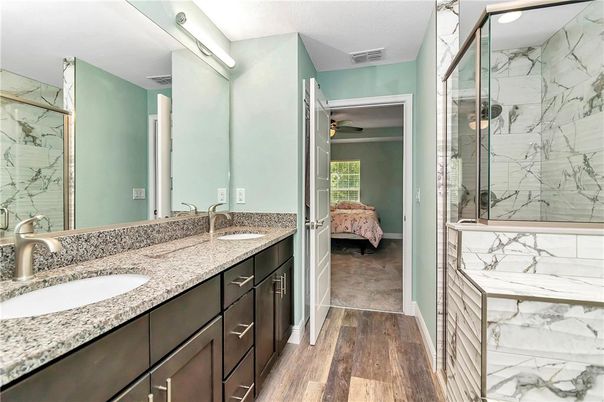 Bathroom, Bedroom, Dual Sink Vanities, Glass Shower, Interior, Marble Walls, Wood Texture Flooring