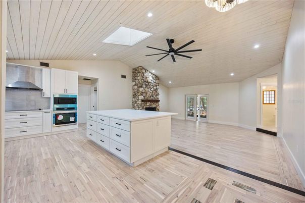 Fireplace, Interior, Kitchen, Recessed Lighting, Wood Texture Flooring