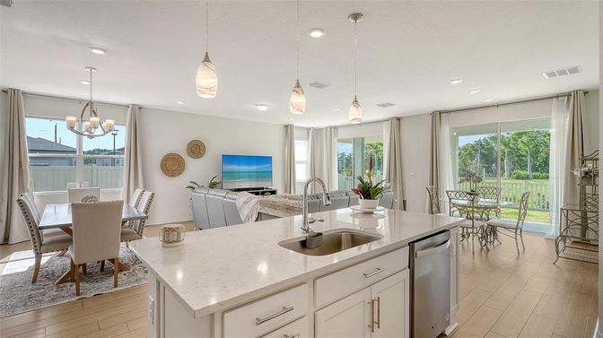 Chandelier, Dining room, Interior, Kitchen, Pendant Lights, Recessed Lighting, Stainless Steel Appliances, Wood Texture Flooring