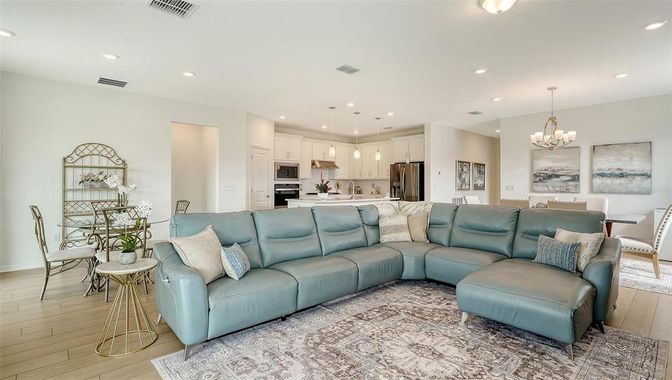 Chandelier, Dining room, Interior, Kitchen, Living room, Pendant Lights, Recessed Lighting, Stainless Steel Appliances, Wood Texture Flooring