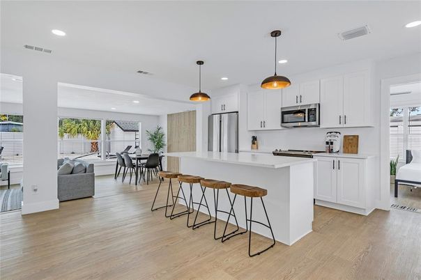Dining room, Interior, Kitchen, Pendant Lights, Recessed Lighting, Stainless Steel Appliances, Wood Texture Flooring