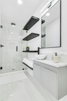 Bathroom, Dual Sink Vanities, Glass Shower, Interior, Marble, Marble Walls, Recessed Lighting