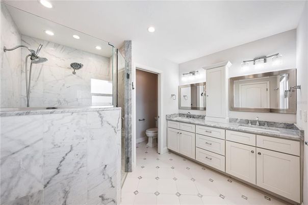 Bathroom, Dual Sink Vanities, Interior, Marble Walls, Recessed Lighting