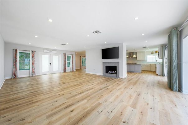 Empty room, Fireplace, Interior, Kitchen, Pendant Lights, Recessed Lighting, Wood Texture Flooring