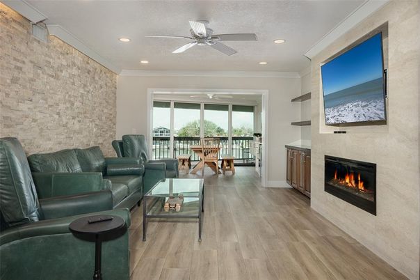 Fireplace, Interior, Living room, Recessed Lighting, Stone Walls, Wood Texture Flooring