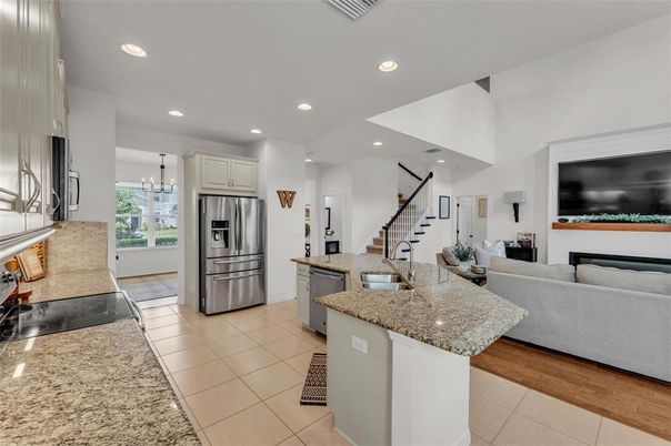 Chandelier, Interior, Kitchen, Living room, Recessed Lighting, Stainless Steel Appliances, Wood Texture Flooring