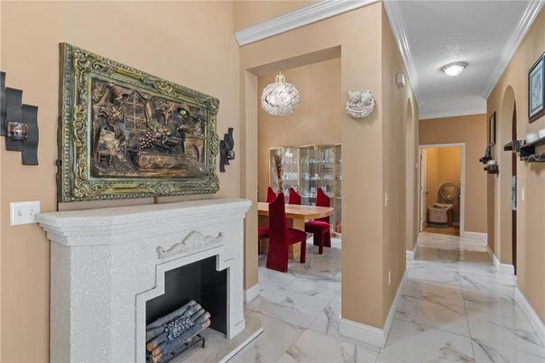 Chandelier, Dining room, Fireplace, Interior, Marble
