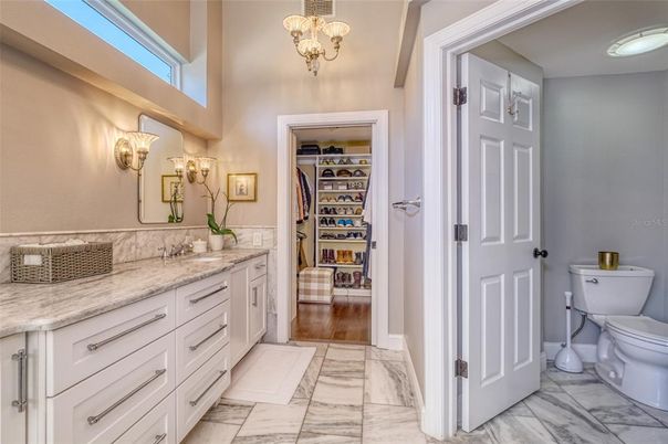 Bathroom, Dual Sink Vanities, Interior, Marble, Pendant Lights, Walk-in Closets, Wood Texture Flooring