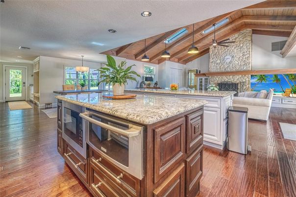 Dining room, Fireplace, Interior, Kitchen, Living room, Pendant Lights, Recessed Lighting, Stainless Steel Appliances, Wooden Beams, Wooden Ceilings, Wood Texture Flooring