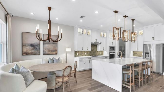 Chandelier, Dining room, Interior, Kitchen, Pendant Lights, Recessed Lighting, Stainless Steel Appliances, Wood Texture Flooring