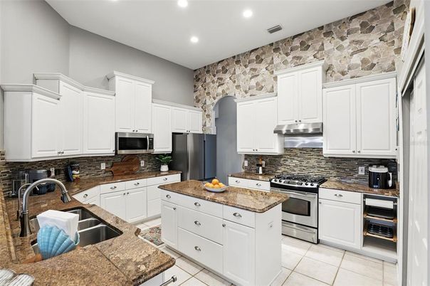 Interior, Kitchen, Recessed Lighting, Stainless Steel Appliances, Stone Walls