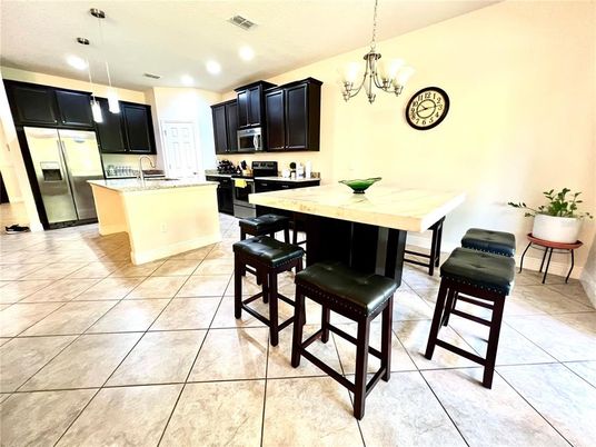 Chandelier, Dining room, Interior, Kitchen, Pendant Lights, Recessed Lighting, Stainless Steel Appliances