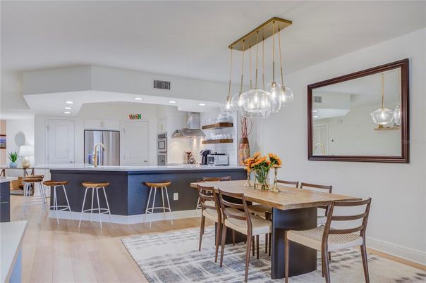 Dining room, Interior, Kitchen, Pendant Lights, Recessed Lighting, Stainless Steel Appliances, Wood Texture Flooring