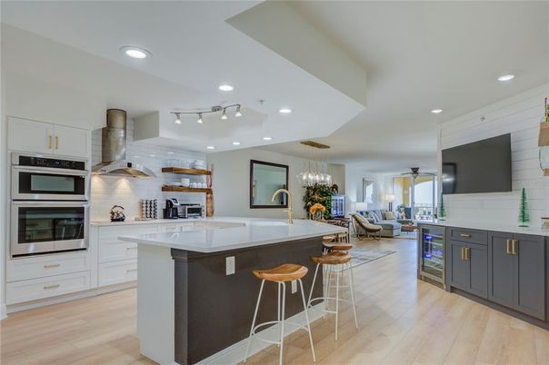 Chandelier, Interior, Kitchen, Living room, Pendant Lights, Recessed Lighting, Stainless Steel Appliances, Wood Texture Flooring