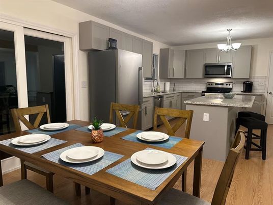 Chandelier, Dining room, Interior, Kitchen, Stainless Steel Appliances, Wood Texture Flooring