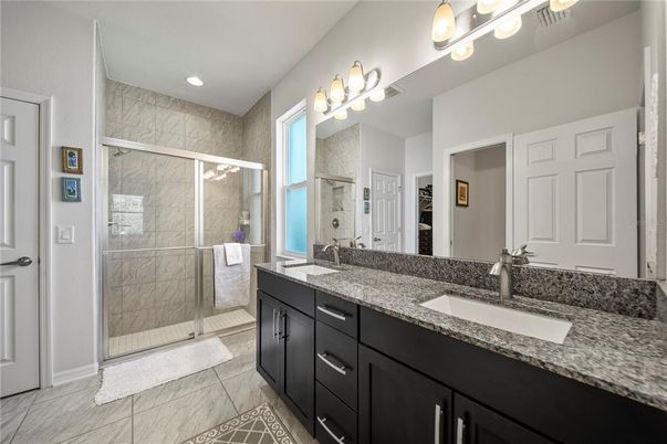 Bathroom, Dual Sink Vanities, Glass Shower, Interior, Marble Walls, Recessed Lighting