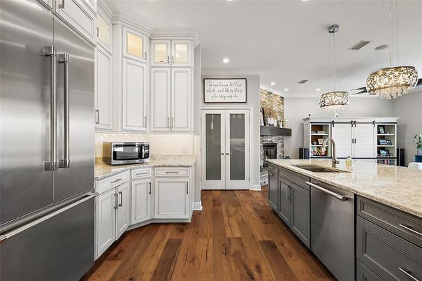 Fireplace, Interior, Kitchen, Pendant Lights, Recessed Lighting, Stainless Steel Appliances, Wood Texture Flooring
