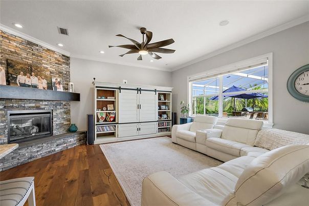 Fireplace, Interior, Living room, Recessed Lighting, Stone Walls, Wood Texture Flooring