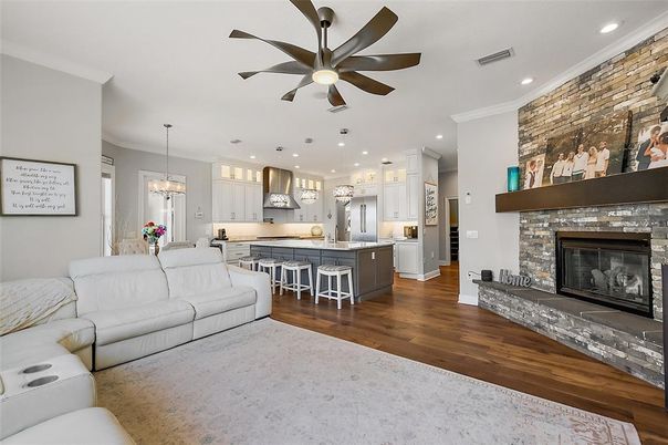 Dining room, Fireplace, Interior, Kitchen, Living room, Pendant Lights, Recessed Lighting, Stainless Steel Appliances, Stone Walls, Wood Texture Flooring