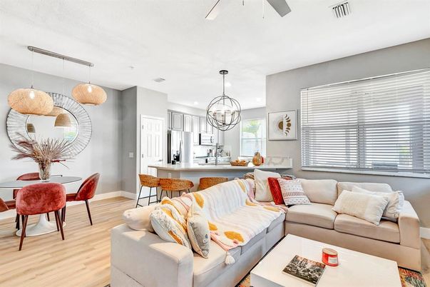 Chandelier, Dining room, Interior, Kitchen, Living room, Pendant Lights, Recessed Lighting, Stainless Steel Appliances, Wood Texture Flooring