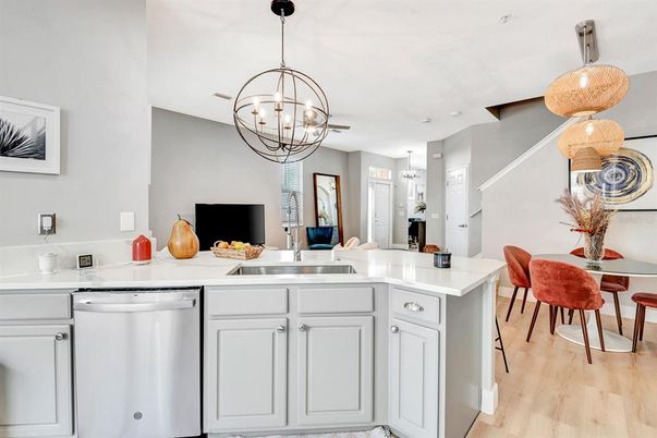 Chandelier, Dining room, Interior, Kitchen, Pendant Lights, Stainless Steel Appliances, Wood Texture Flooring