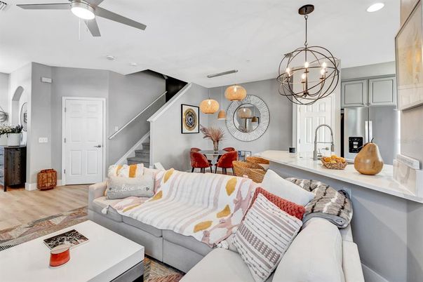 Chandelier, Dining room, Interior, Kitchen, Living room, Pendant Lights, Recessed Lighting, Stainless Steel Appliances, Wood Texture Flooring