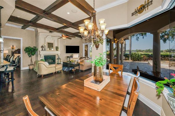 Chandelier, Dining room, Fireplace, Interior, Living room, Recessed Lighting, Wooden Beams, Wood Texture Flooring