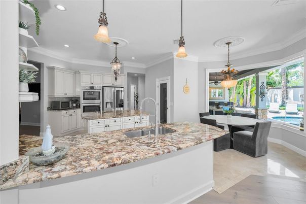 Dining room, Interior, Kitchen, Pendant Lights, Recessed Lighting, Stainless Steel Appliances, Wood Texture Flooring