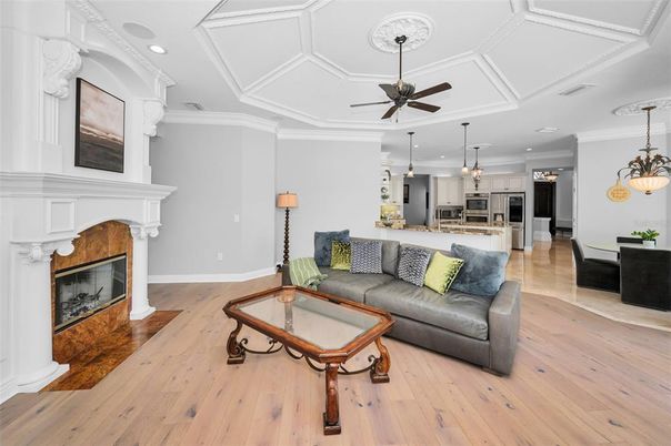 Fireplace, Interior, Kitchen, Living room, Pendant Lights, Recessed Lighting, Stainless Steel Appliances, Wood Texture Flooring