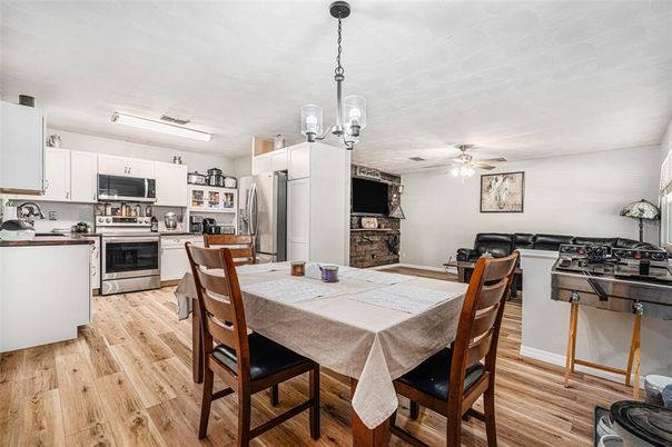 Dining room, Interior, Kitchen, Pendant Lights, Stainless Steel Appliances, Wood Texture Flooring
