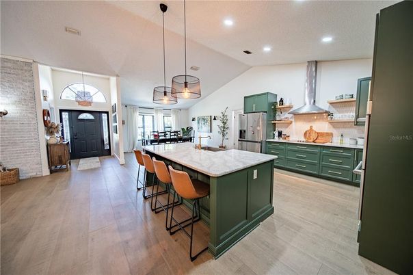Interior, Kitchen, Pendant Lights, Recessed Lighting, Stainless Steel Appliances, Stone Walls, Wood Texture Flooring