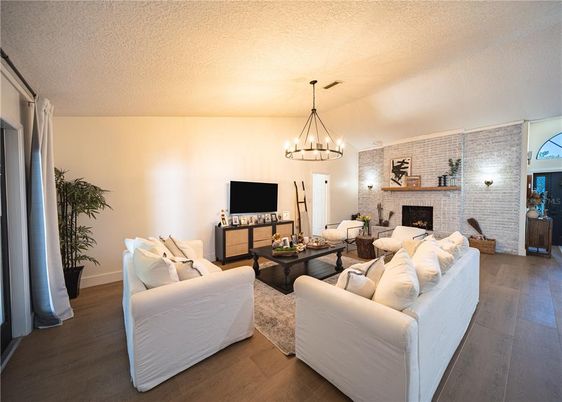 Chandelier, Fireplace, Interior, Living room, Stone Walls, Wood Texture Flooring