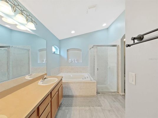 Bathroom, Dual Sink Vanities, Glass Shower, Interior, Recessed Lighting, Wood Texture Flooring