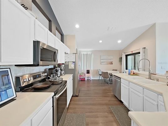 Dining room, Interior, Kitchen, Recessed Lighting, Stainless Steel Appliances, Wood Texture Flooring