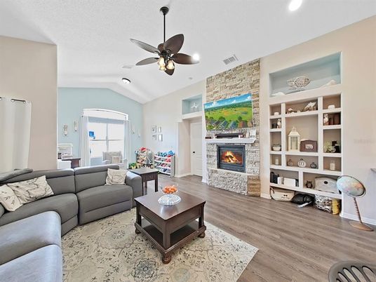 Fireplace, Interior, Living room, Recessed Lighting, Stone Walls, Wood Texture Flooring
