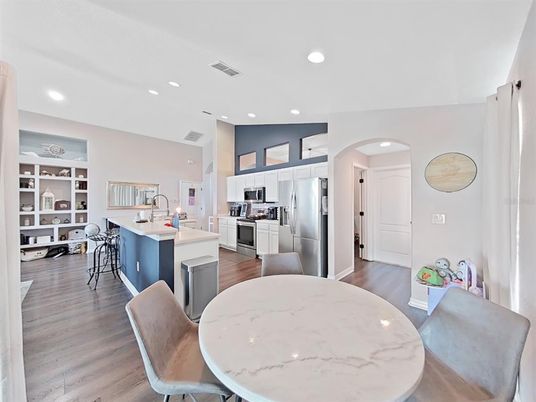 Dining room, Interior, Kitchen, Recessed Lighting, Stainless Steel Appliances, Wood Texture Flooring