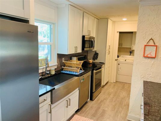 Interior, Kitchen, Recessed Lighting, Washer, Wood Texture Flooring