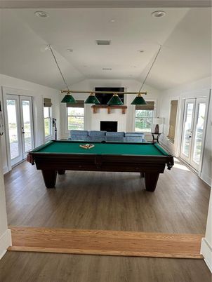 Billiard Table, Fireplace, Game Room, Interior, Pendant Lights, Recessed Lighting, Wood Texture Flooring