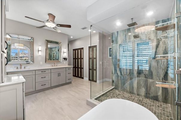 Bathroom, Dual Sink Vanities, Glass Shower, Interior, Recessed Lighting, Wood Texture Flooring