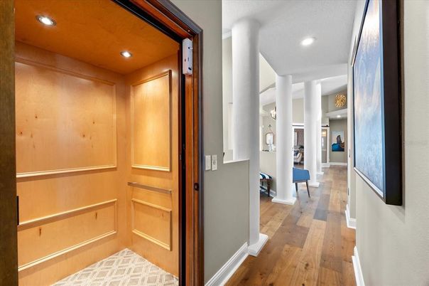 Elevator, Interior, Recessed Lighting, Wood Texture Flooring, Wooden Walls